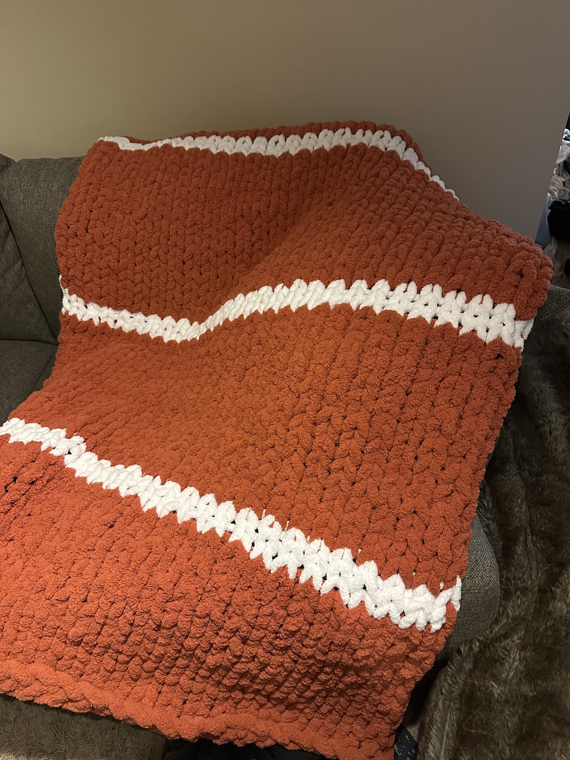 Hand-knit adult throw orange stripe blanket