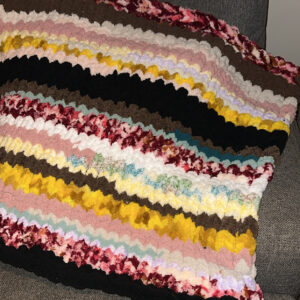 Hand-knitted striped baby blanket
